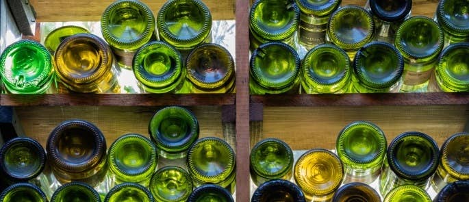 Empty glass bottles stacked up