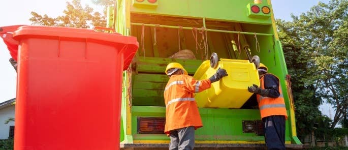Recycling bins being emptied into a collection lorry