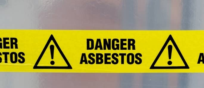 Asbestos tape sign on construction site