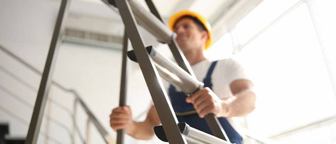 a person inspecting a ladder
