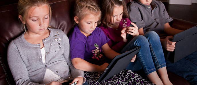 children on phones and tablets