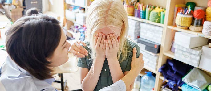 child upset as she is struggling with separation anxiety 