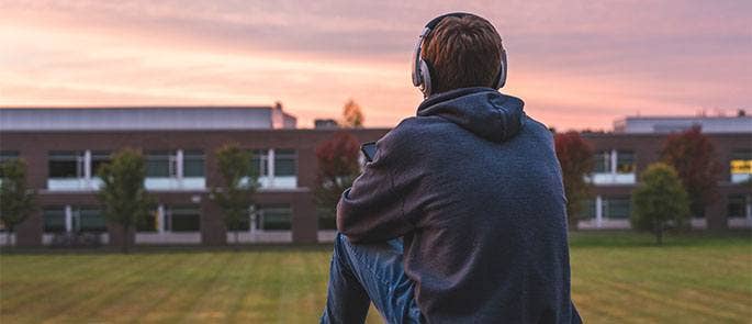 Teenager sat outside school