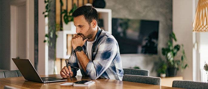 A man completing a training course online