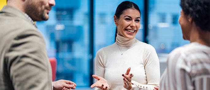 Female worker talking to her colleagues