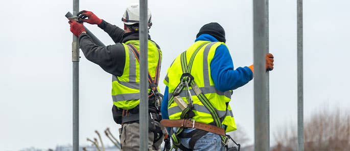 scaffolders erecting scaffolding