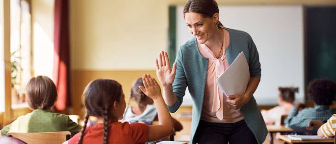 Teacher in classroom with students