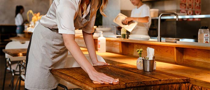 employees cleaning a restaurant in line with SALSA standards