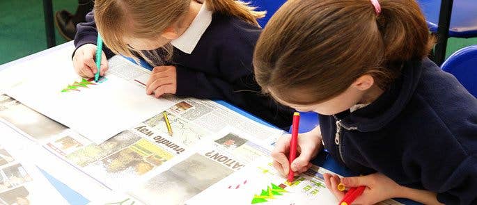 Children decorating Christmas cards in school