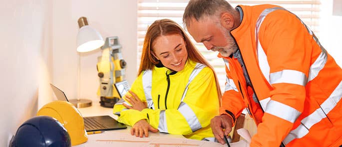 site manager working with colleague in an office