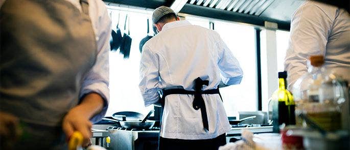 Kitchen staff preparing for a food inspection