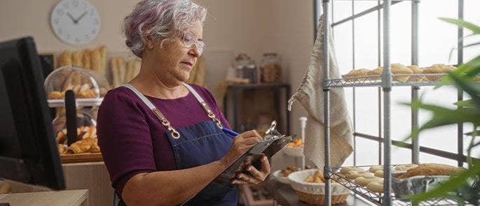 Woman in bakery preparing for a food inspection