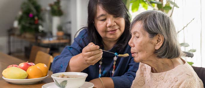 Elderly person being cared for