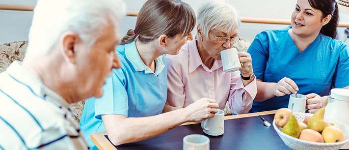 Elderly people in a care home being cared for