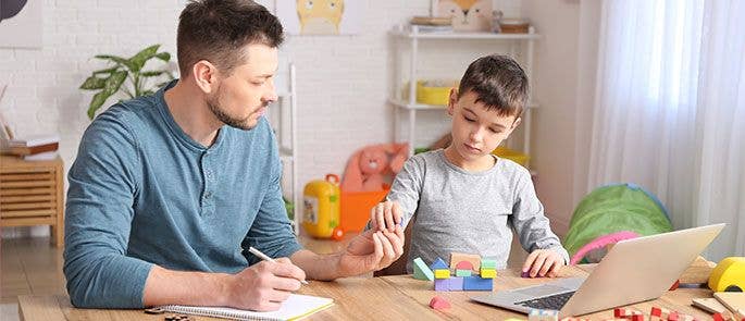 A special educational needs coordinator working with an SEN pupil